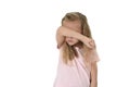 Sweet young little schoolgirl covering her face with her arm crying sad victim of bullying at school Royalty Free Stock Photo