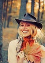 Sweet young sensual sexy woman walking in autumn park. Autumnal vogue trend. Autumn woman having fun at the park and Royalty Free Stock Photo