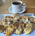 sweeten a day with fried choco cheese banana and cup a coffee for a complete