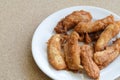 Sweetened fried bananas in white plate