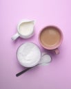 Sweetening coffee with milk with a sweetener Royalty Free Stock Photo