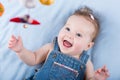 Sweetest baby girl playing with a colorful mobile toy Royalty Free Stock Photo