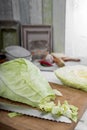 Sweetheart cabbage on chopping board Royalty Free Stock Photo