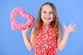 Sweetheart child with long hair smiling in red dress Royalty Free Stock Photo