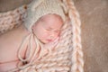 Newborn baby sleeps on his tummy.