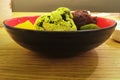 Sweetness and freshness homemade  matcha green tea ice cream ,japanese dessert, with smash red bean and fruits in restaurant for Royalty Free Stock Photo