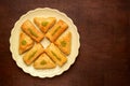 Sweets arabic dessert baklava, , kunafa, kadayif with pistachio nuts and cheese . Top view, copy space