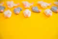 Sweets. Blur Marshmallows in the shape white and gray mice or rats on yellow background, copy space. 2020 new year background and Royalty Free Stock Photo