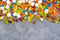 Sweets and candies background. Different candies, marshmallows, marmalade, yummi gummi scattered on the table. Royalty Free Stock Photo
