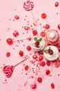 Sweets. Candy And Cupcakes On Pink Background