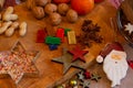 Sweets and candy on a wooden plate with decoration and a rolling pin. Christmas Sweets for children