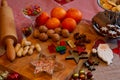 Sweets and candy on a wooden plate with decoration and a rolling pin. Christmas Sweets for children