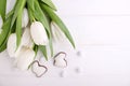 Sweets for celebrate Easter. White tulips, chocolate eggs Royalty Free Stock Photo