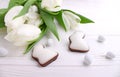 Sweets for celebrate Easter. White tulips, chocolate eggs Royalty Free Stock Photo