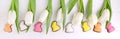 Sweets for celebrate Easter. White tulips, chocolate eggs and ea Royalty Free Stock Photo