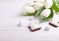 Sweets for celebrate Easter. White tulips, chocolate Royalty Free Stock Photo