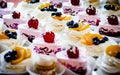 Sweets, colorful cupcakes with fruit on a tray Royalty Free Stock Photo