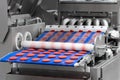 Sweets factory. Sweets production process. Conveyor belt with sweets on it