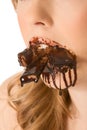 Sweets lover - mouth stuffed with chocolates Royalty Free Stock Photo