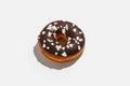 Sweets minimalism concept. Delicious donut with chocolate and white crumb for delivery at home during covid-19 epidemic
