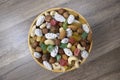 Sweets, raisin, candied fruit and nuts in a bowl on a table