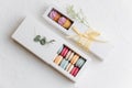 Sweets in rectangle pull out boxes. Macarons and waffle cones with zefir on top Royalty Free Stock Photo