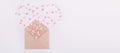 Sweets sugar candy hearts fly out in the form of heart from craft paper envelope on the white background . Valentine day concept. Royalty Free Stock Photo