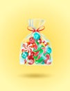 Sweets in a transparent bag tied with a red ribbon on a golden background. Candy gift for christmas, new year, birthday Royalty Free Stock Photo