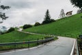 Swerving dangerous road on a hill during wet and bad weather conditions Royalty Free Stock Photo