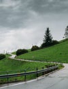 Swerving dangerous road on a hill during wet and bad weather conditions Royalty Free Stock Photo