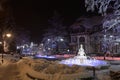 Swieradow Zdroj resort, Poland, December 13, 2018: Illuminated fountain in city center park in winter night, f J