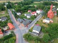 Swieszyno city, aerial view on main road, buildings and red brick church