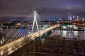 Swietokrzyski Bridge over the Vistula River with a panoramic view of the center of Warsaw at night. Poland Royalty Free Stock Photo