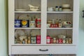 Swift Current, SK/Canada- July 29, 2019: Vintage containers in antique kitchen cupboard