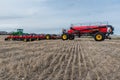 Swift Current, SK/Canada- May 4, 2019: Farmer, tractor and air drill seeding equipment in Saskatchewan, Canada