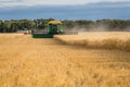 Swift Current, SK, Canada- Sept 8, 2019: Two combines and grain truck harvesting wheat