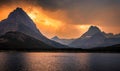 Swiftcurrent Lake and Mountain Fire Sky Sunset at Many Glacier, Glacier National Park, Montana Royalty Free Stock Photo