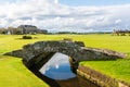 The Swilcan Bridge, or Swilken Bridge, a famous small stone bridge spanning the Swilcan Burn in St Andrews Links golf course, Royalty Free Stock Photo