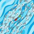 Swim against the tide - one fish is swimming in another direction - symbol for courage, individuality, method of recruitment, Royalty Free Stock Photo