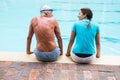 Swim coach interacting with senior man Royalty Free Stock Photo