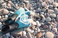 Swim flippers, mask, snorkel in the surf on the sandy beach, selective focus Royalty Free Stock Photo