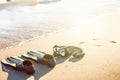 Swim flippers with snorkel, mask and feet steps on a sandy beach. Water sports. Snorkeling. Travel and holiday concept. Fins and s Royalty Free Stock Photo