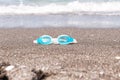 Swim goggles on the sand. Royalty Free Stock Photo