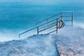 Swim ladder leading to mystic sea