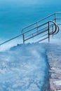 Swim ladder leading to mystic sea Royalty Free Stock Photo