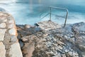 Swim ladder leading to stormy mystic sea Royalty Free Stock Photo