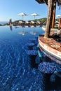 Swim-up bar in infinity pool in tropics Royalty Free Stock Photo