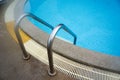 Swimming pool stair reach down into the water Royalty Free Stock Photo