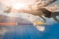 Swimmer in back crawl style underwater Royalty Free Stock Photo