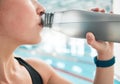 Swimmer, bottle or woman drinking water to relax on break after exercise, workout or fitness training. Hydrate, closeup